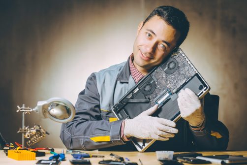 Computer Technician Fixing Laptop Computer in Katy, TX