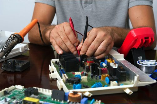 computer technician fixing computer in Katy, TX